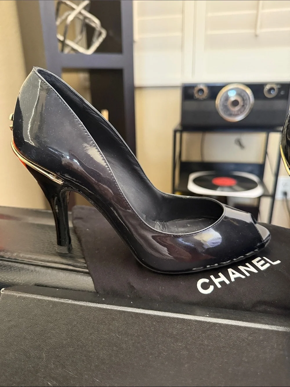 CHANEL Black Patent Peep-Toe Stiletto Pumps with Gold CC Heel Accent